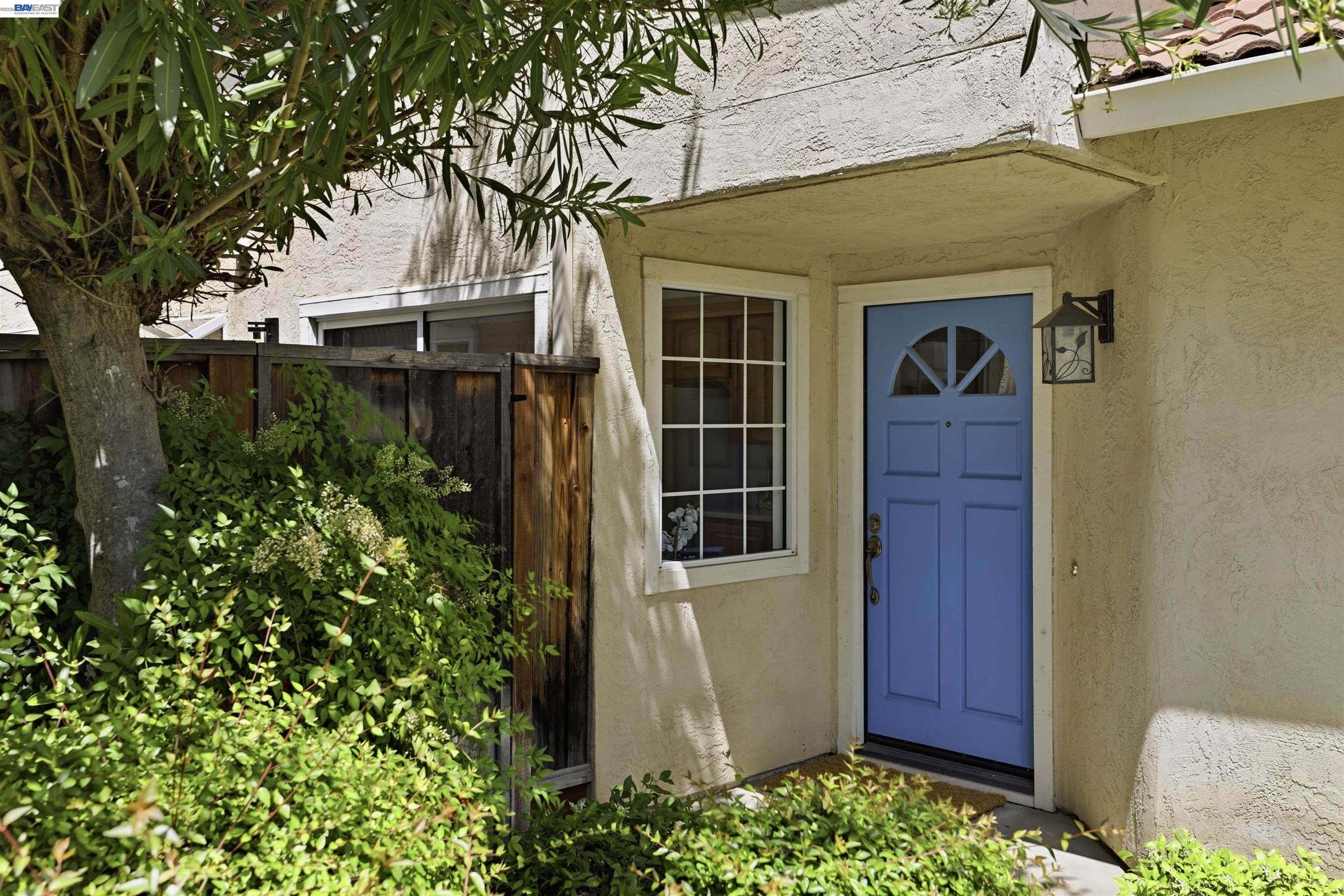 4161 Garibaldi Place Pleasanton, CA 94566 - Photo 9 of 47 a front view of a house with a garden