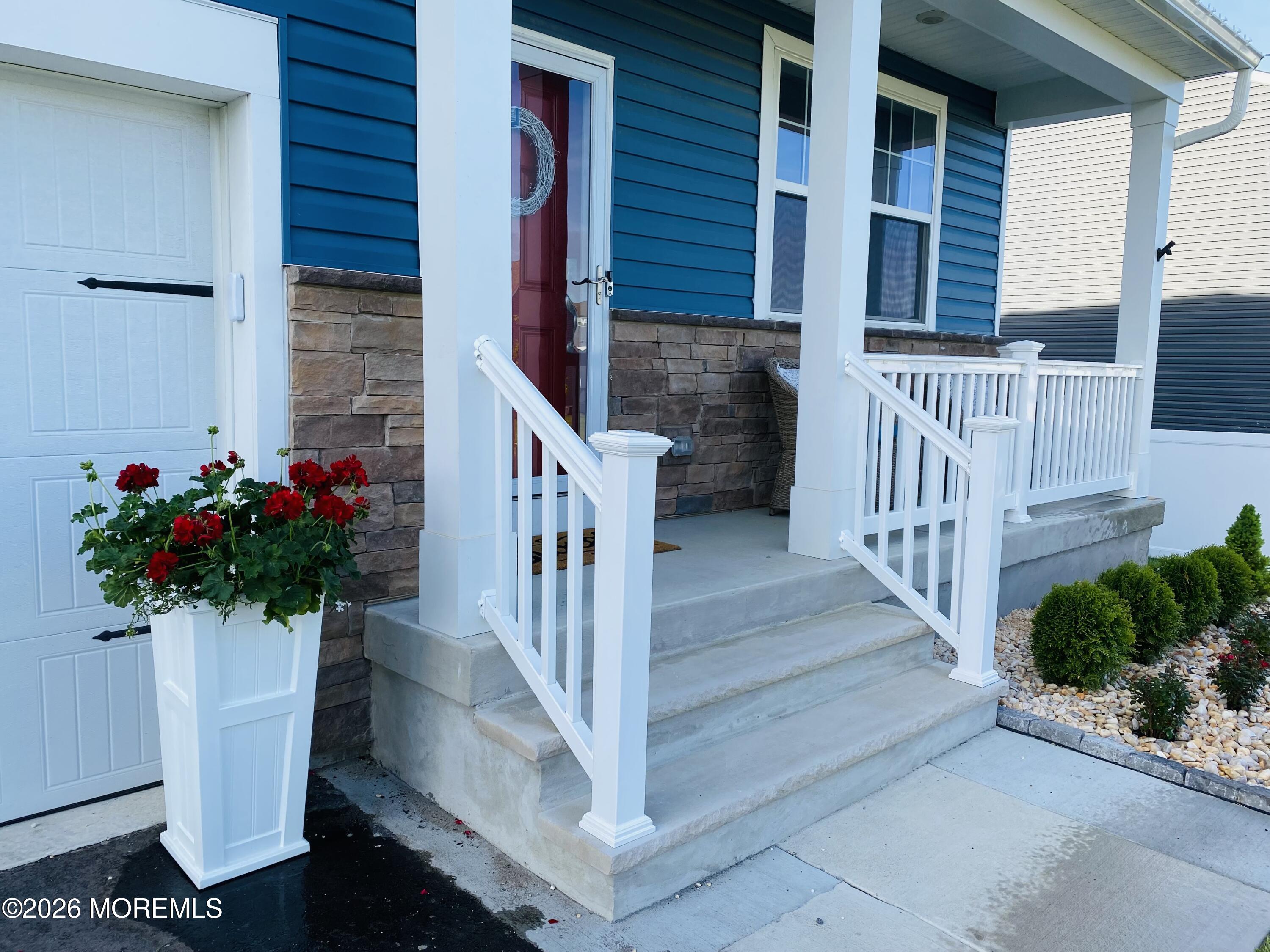 143 Cox Road Barnegat, NJ 08005 - Photo 2 of 4 a view of stairs and potted plants