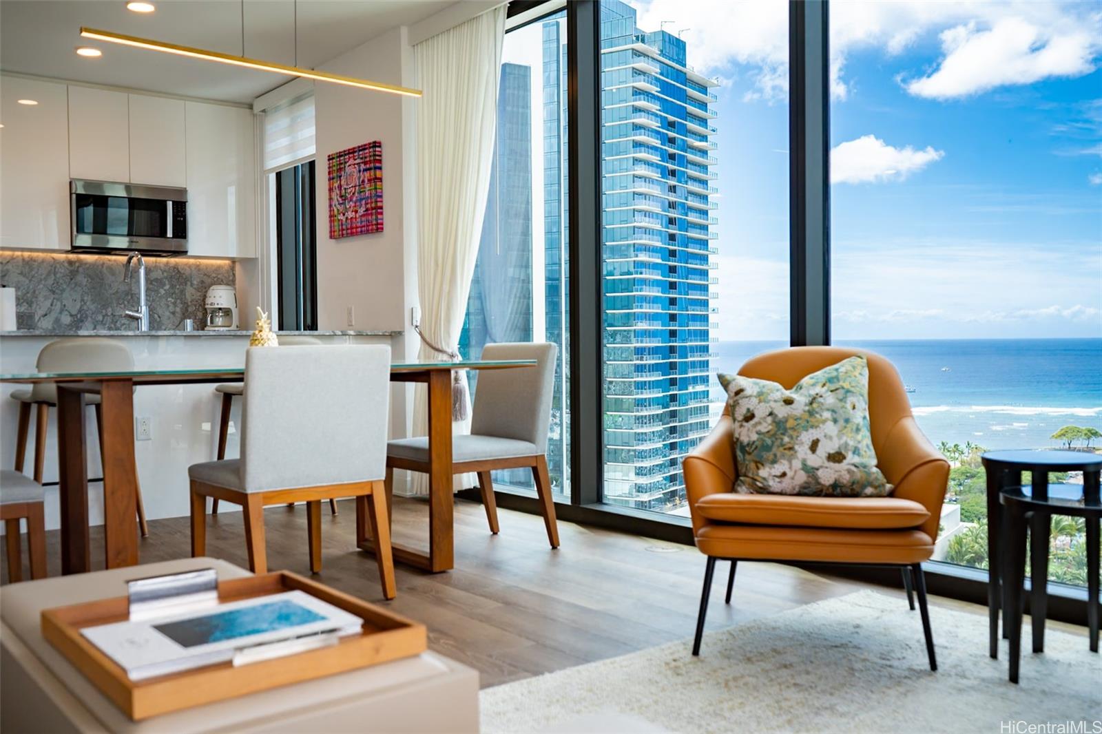 987 Queen Street, Unit 2001 Honolulu, HI 96814 - Photo 6 of 6 a living room with furniture and a rug