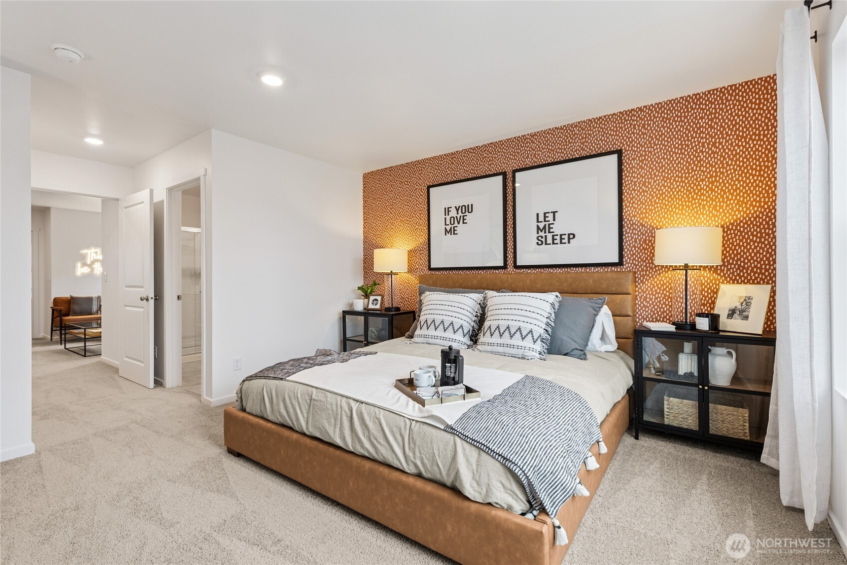8337 Ostrom Avenue Southeast, Unit 101 Lacey, WA 98513 - Photo 14 of 28 a bedroom with a bed and a lamp