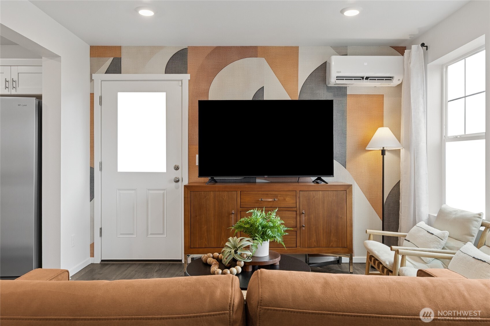 8337 Ostrom Avenue Southeast, Unit 101 Lacey, WA 98513 - Photo 2 of 28 a living room with furniture and a flat screen tv
