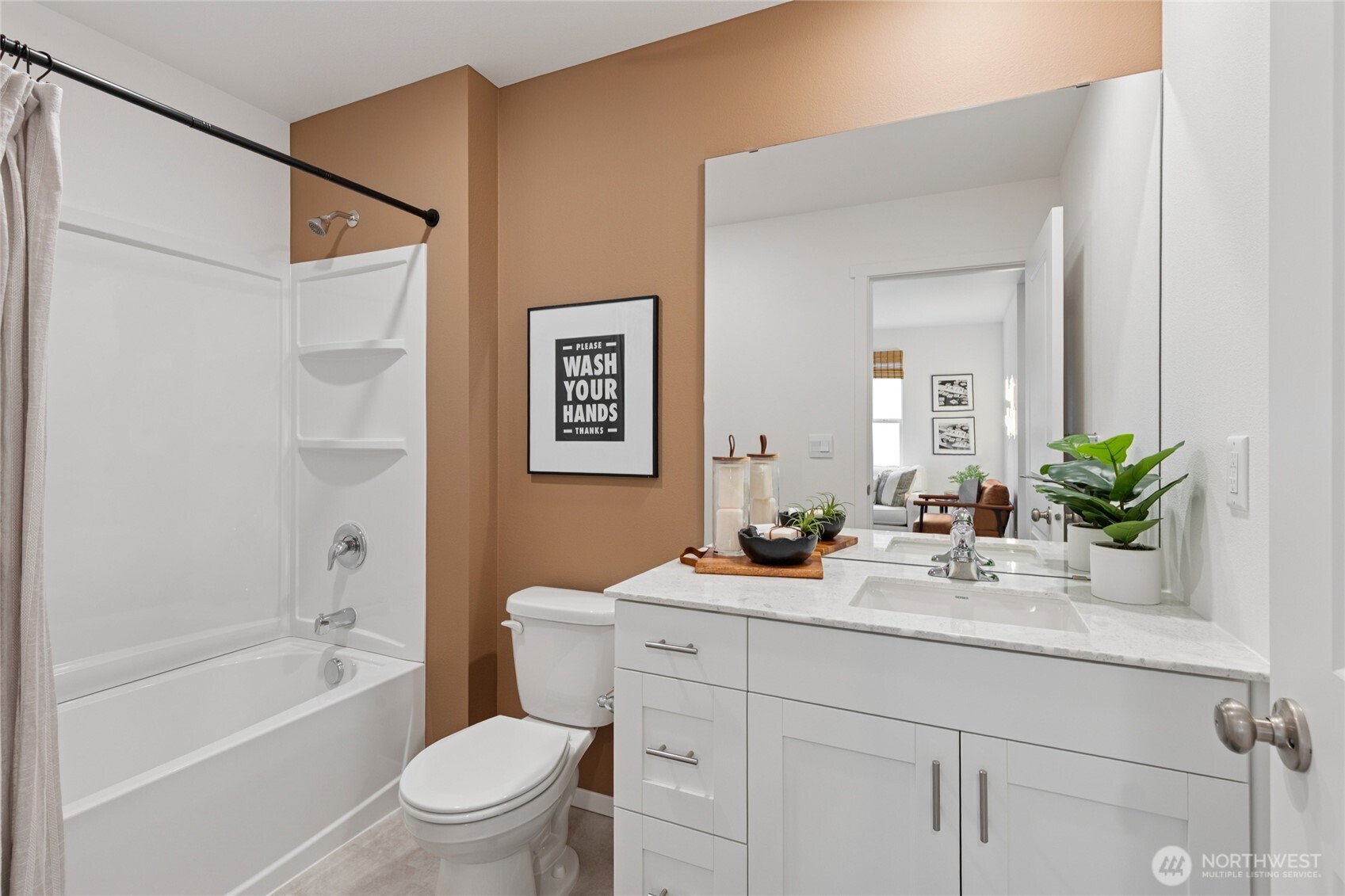 8337 Ostrom Avenue Southeast, Unit 101 Lacey, WA 98513 - Photo 22 of 28 a bathroom with a granite countertop sink a toilet and a bathtub