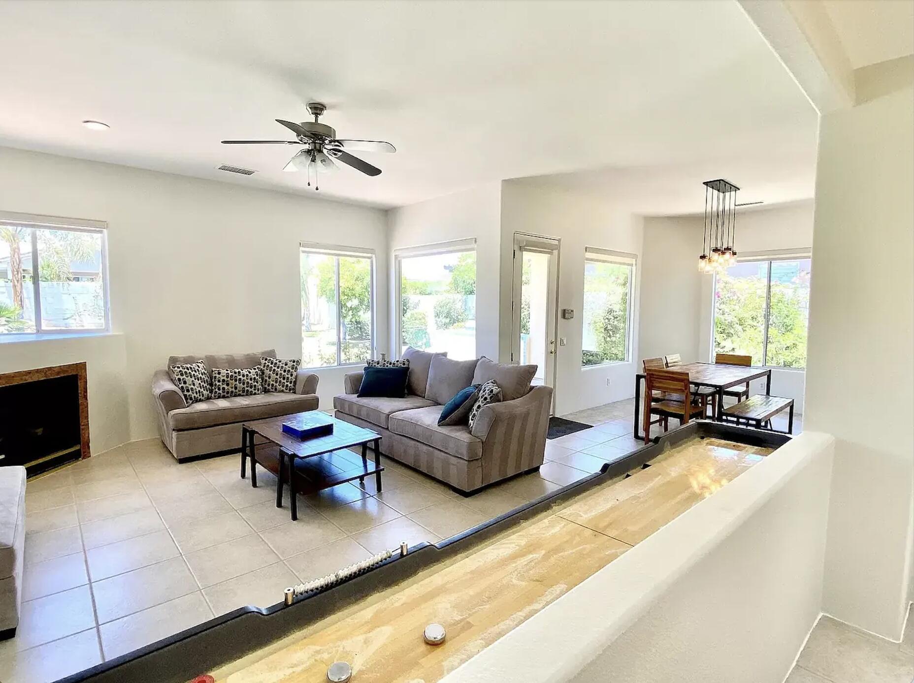 5 Victoria Falls Drive Rancho Mirage, CA 92270 - Photo 17 of 26 a living room with furniture and a fireplace