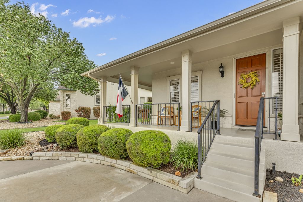 144 Cattle Trail Way Georgetown, TX 78633 - Photo 2 of 37 A welcoming covered porch with ample seating provides a lovely entry to this charming residence.