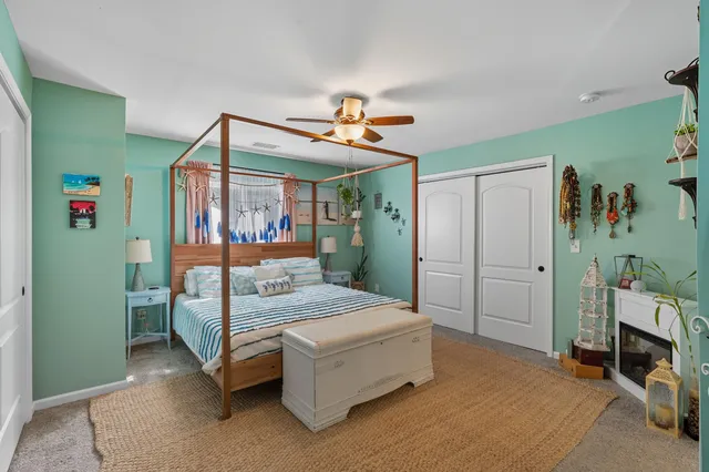 a bathroom with a double vanity sink mirror and toilet
