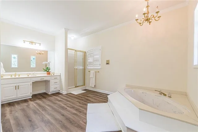 a bathroom with a granite countertop sink a toilet and bathtub