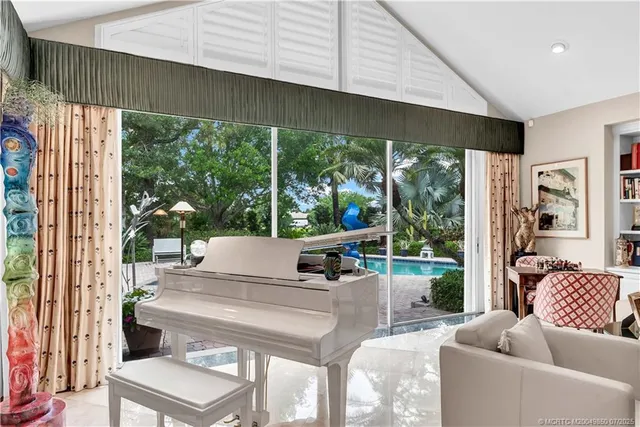a view of a dining room with furniture wooden floor and chandelier