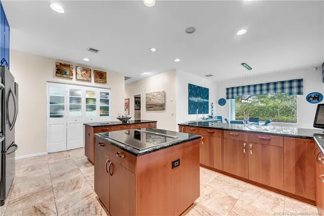 a view of a dining room with furniture large windows and wooden floor