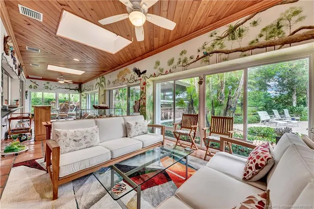a kitchen with a stove a sink and a refrigerator