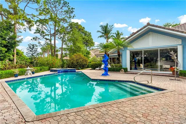 a view of a patio with a chairs and table in a patio
