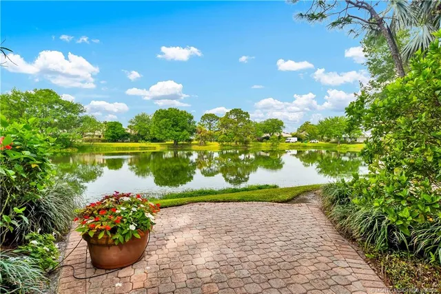a front view of a house with a yard and a garage
