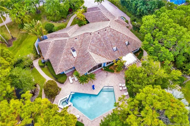 a view of a swimming pool with a garden