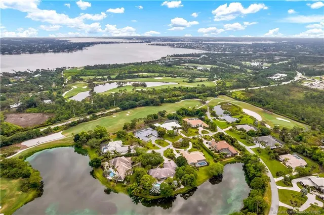 an aerial view of lake residential houses with outdoor space