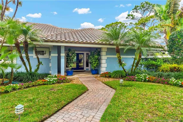 a view of a big room with windows and entryway