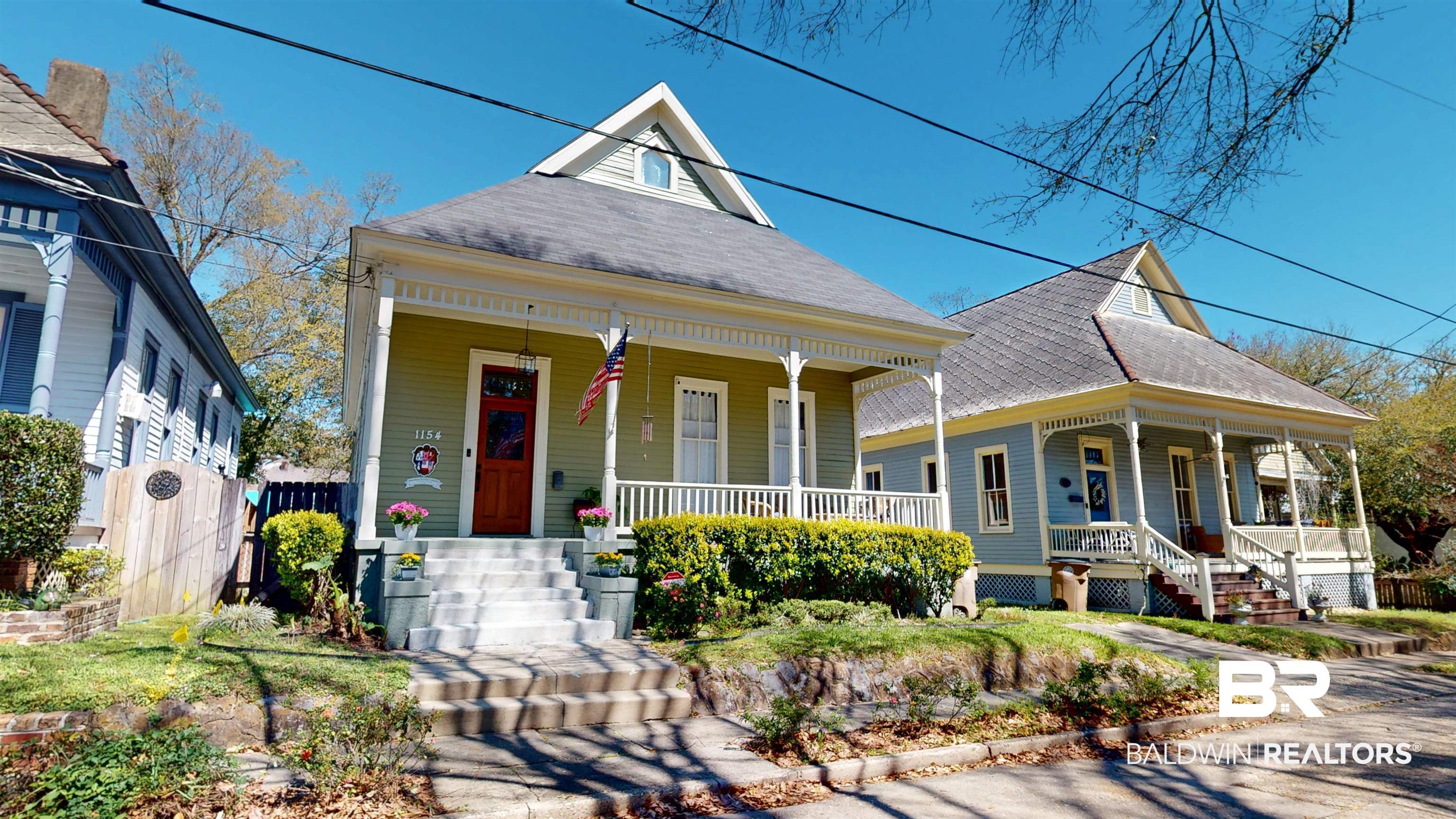 1154 New St Francis Street Mobile, AL 36604 - Photo 3 of 37 View of front facade with a porch, fence, and roof with shingles