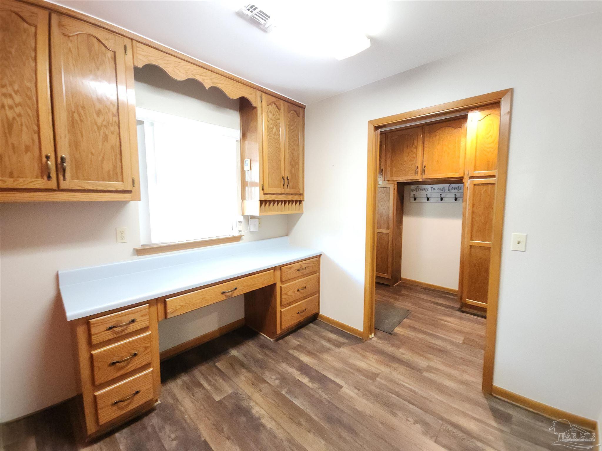 5560 Morgan Road Walnut Hill, FL 32568 - Photo 24 of 63 a kitchen with stainless steel appliances granite countertop a refrigerator and a stove