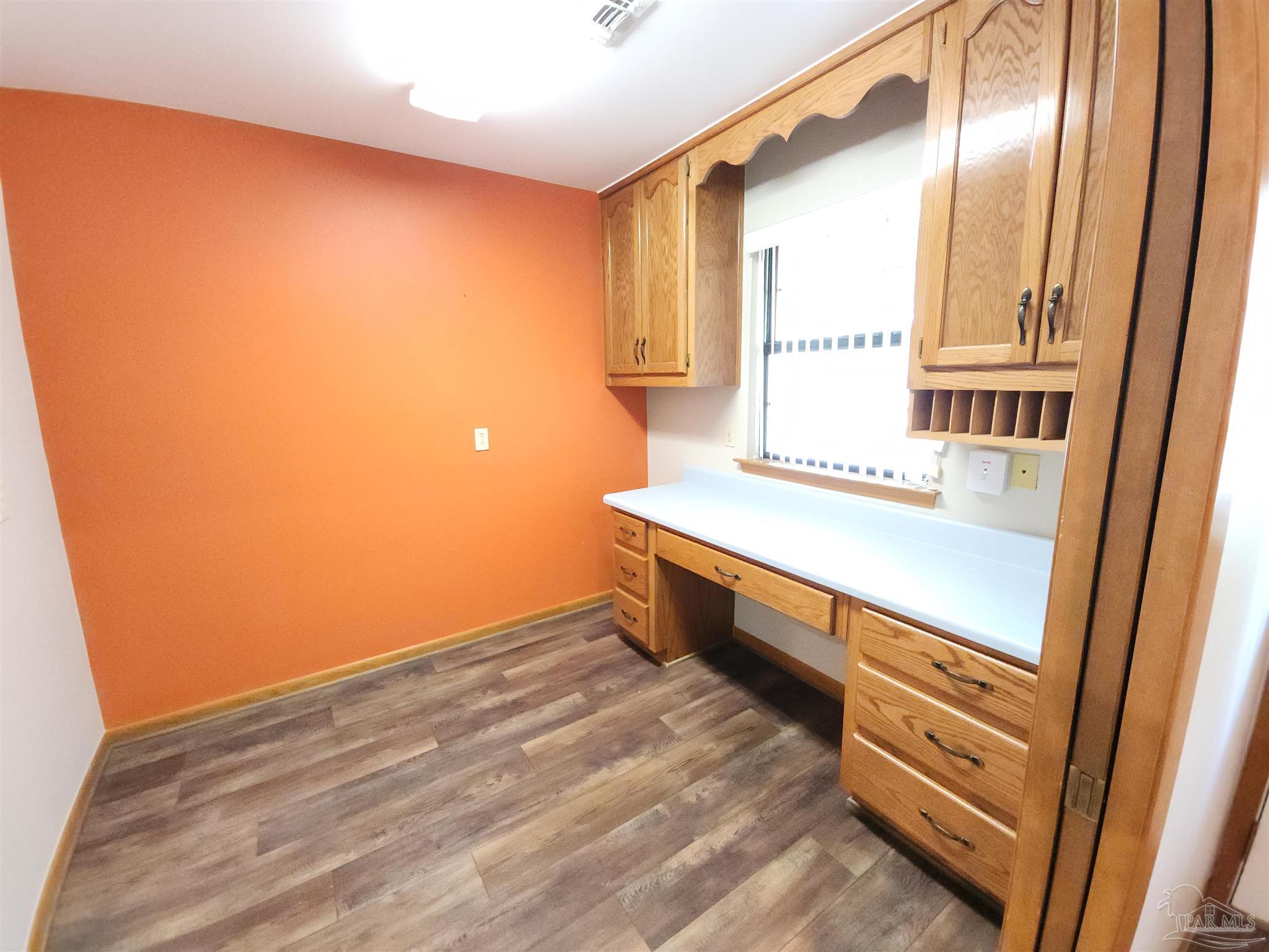 5560 Morgan Road Walnut Hill, FL 32568 - Photo 26 of 63 a bathroom with a sink and a mirror