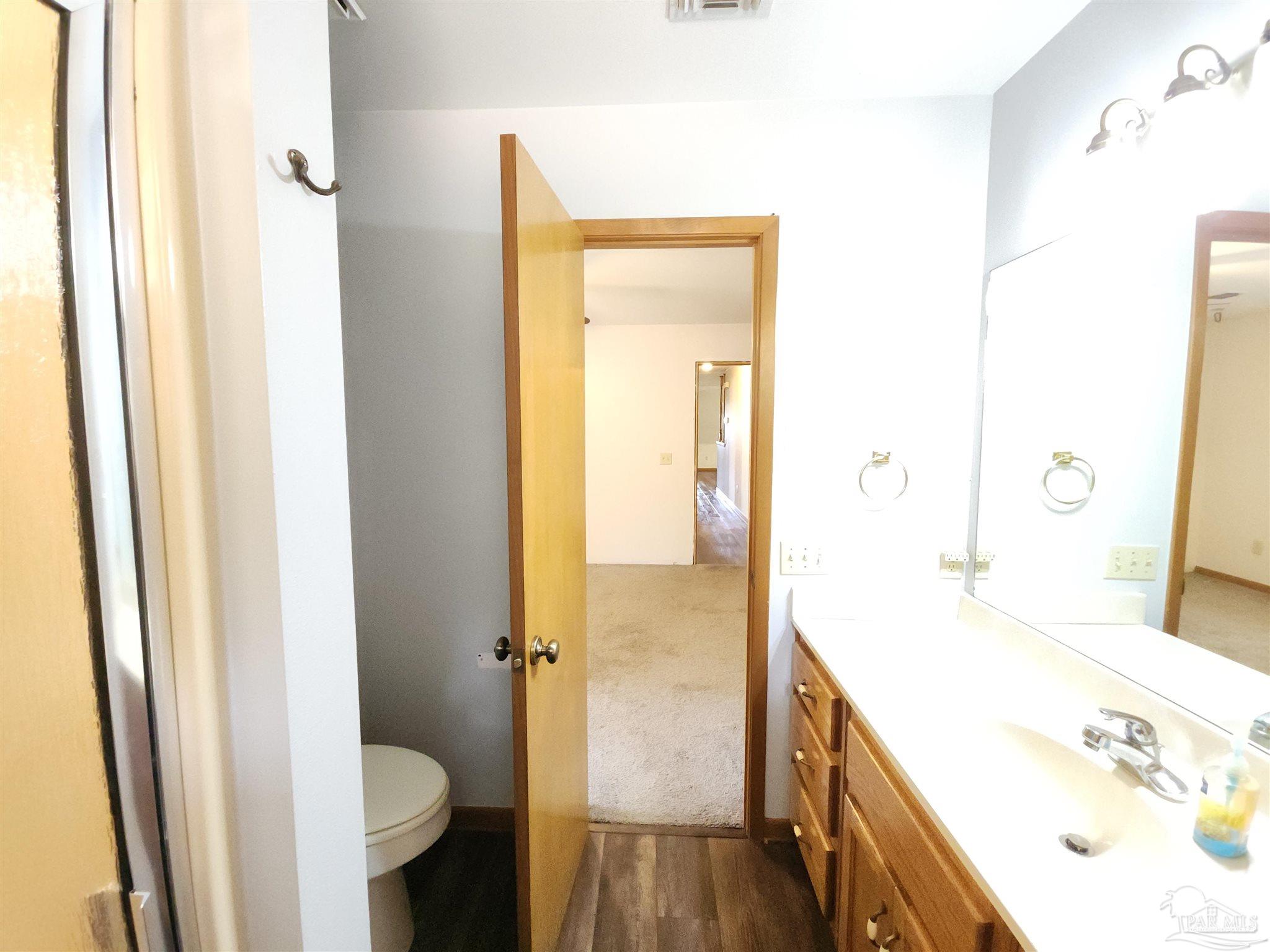 5560 Morgan Road Walnut Hill, FL 32568 - Photo 36 of 63 a bathroom with a sink and a mirror