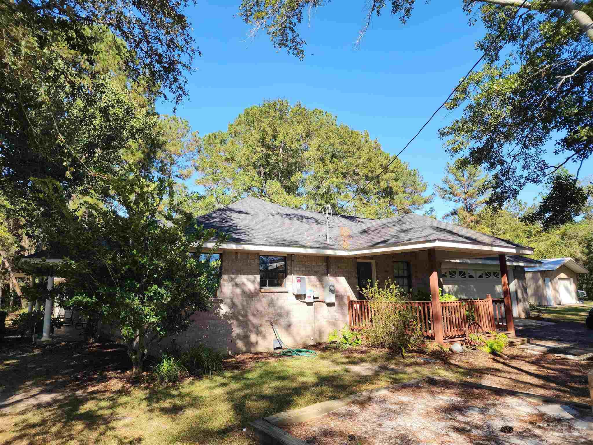 5560 Morgan Road Walnut Hill, FL 32568 - Photo 49 of 63 a front view of a house