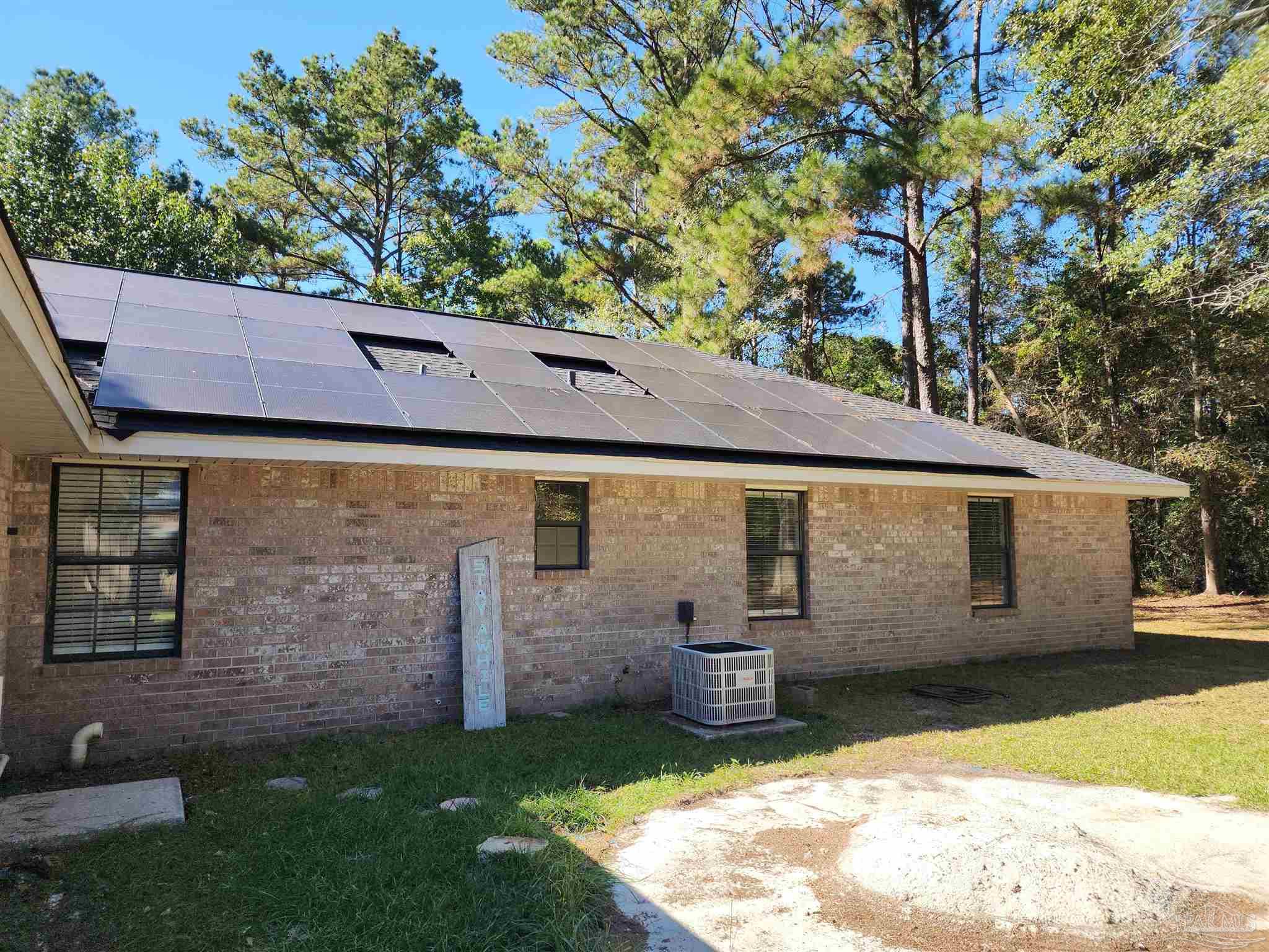 5560 Morgan Road Walnut Hill, FL 32568 - Photo 52 of 63 a view of a back yard of the house