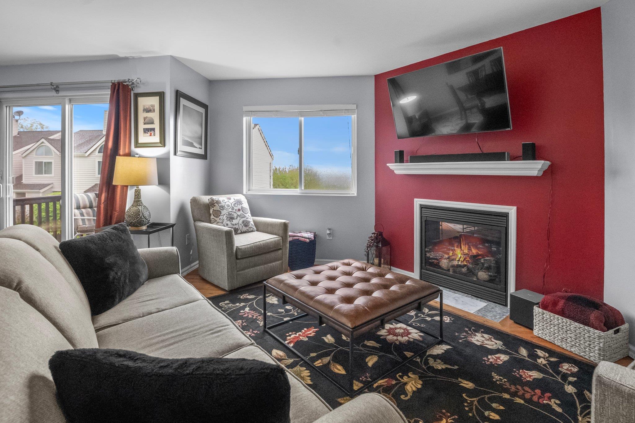 1303 Eagles Ridge Road Brewster, NY 10509 - Photo 1 of 1 Living area with a fireplace with flush hearth and wood finished floors