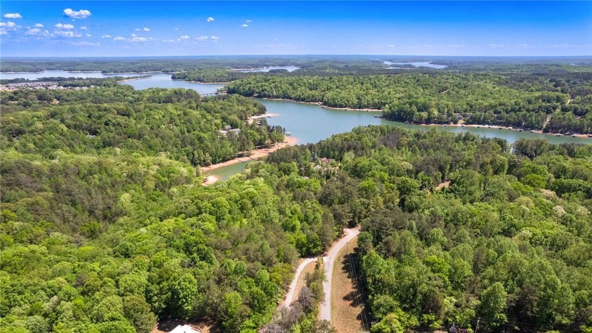 26 Wilbanks Road Seneca, SC 29678 - Photo 1 of 47 This elevated view captures the tranquil waters and expansive green landscape.