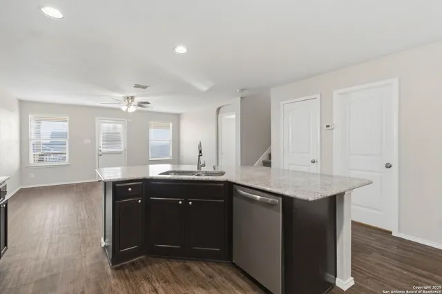 a kitchen with a sink and cabinets