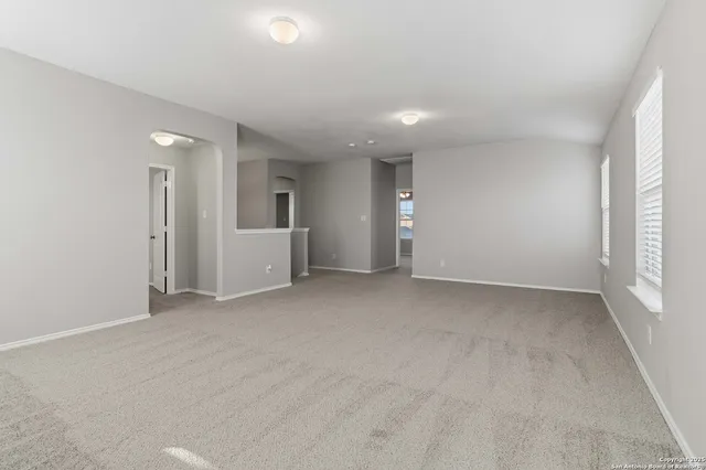 an empty room with windows