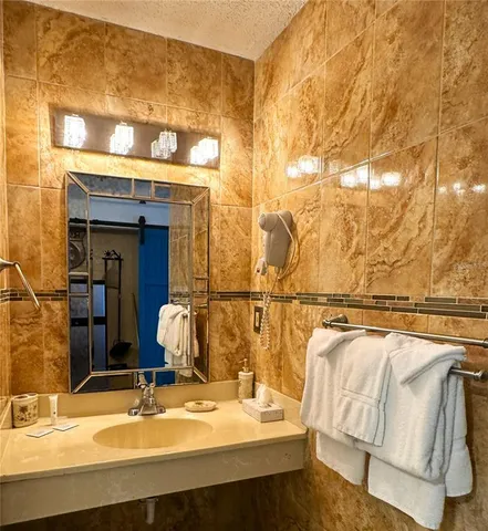 a white toilet sitting next to a shower curtain