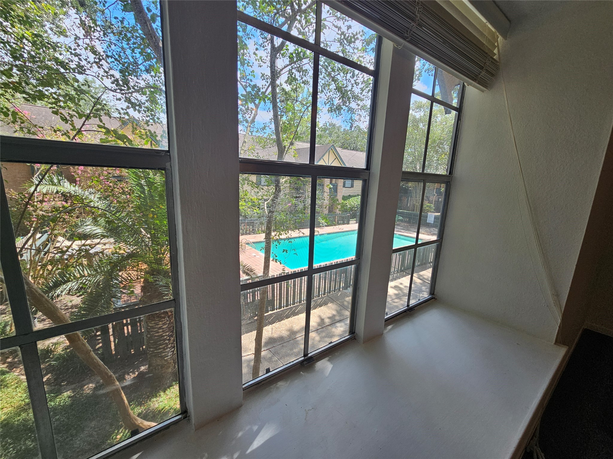 8287 Kingsbrook Road, Unit 268 Houston, TX 77024 - Photo 19 of 50 a view of an empty room with windows