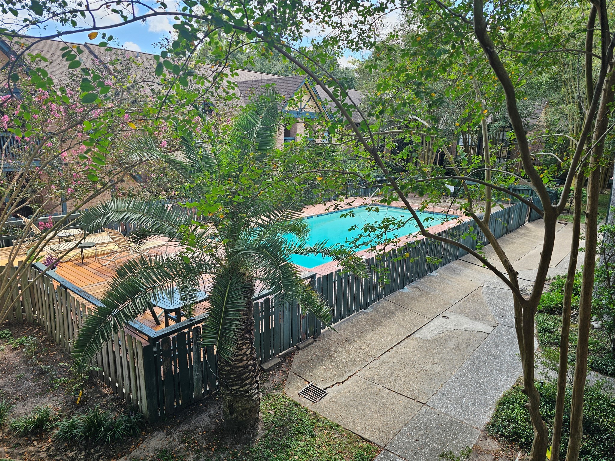 8287 Kingsbrook Road, Unit 268 Houston, TX 77024 - Photo 2 of 50 a view of a park with large trees