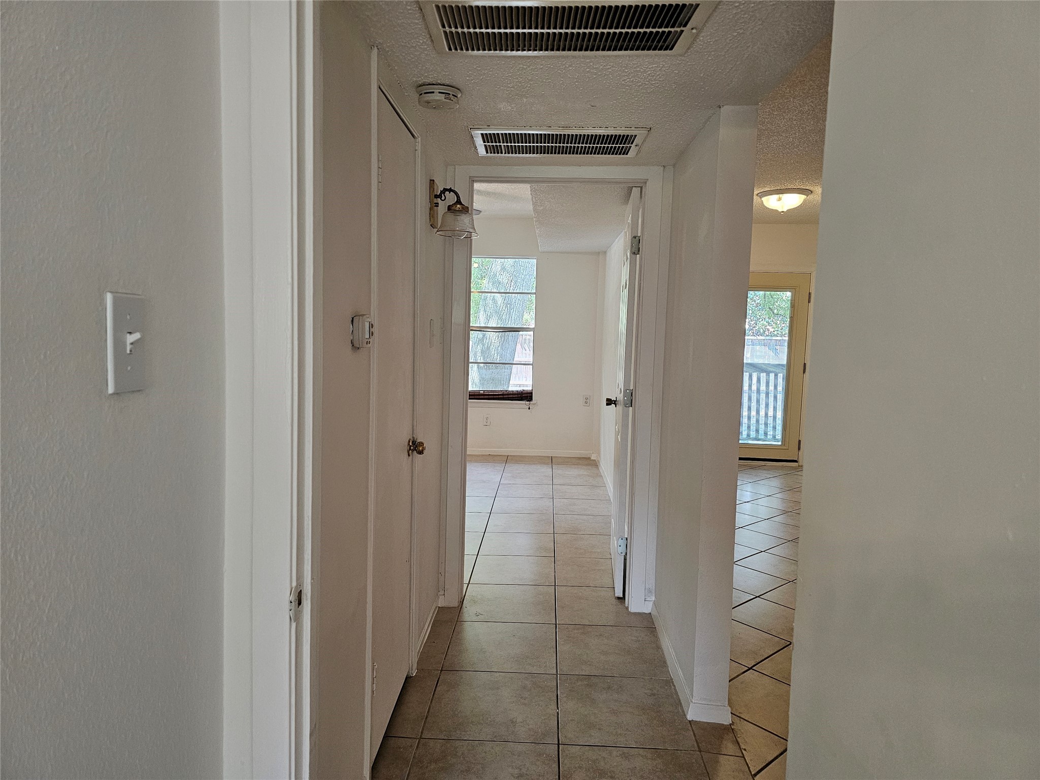 8287 Kingsbrook Road, Unit 268 Houston, TX 77024 - Photo 27 of 50 a view of a hallway with wooden shelves