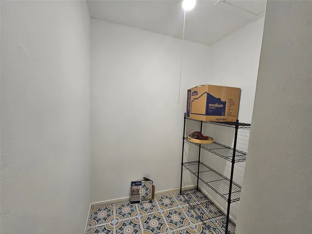 a bedroom with a bed and a table in it