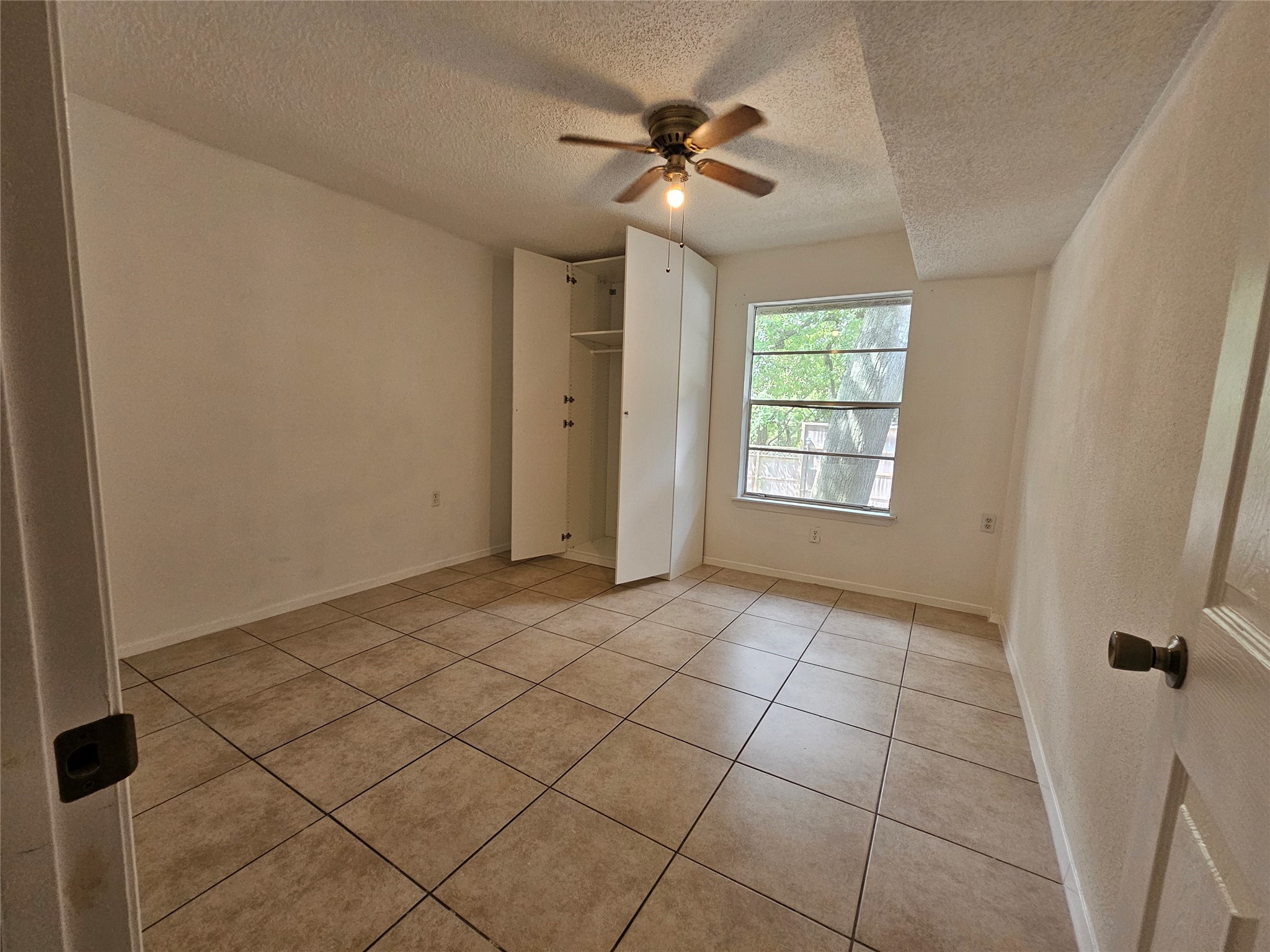 8287 Kingsbrook Road, Unit 268 Houston, TX 77024 - Photo 36 of 50 a view of an empty room with a window