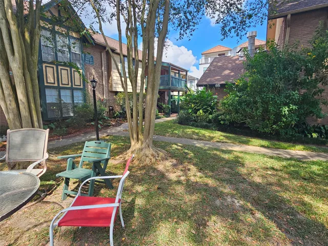 a view of yard with patio