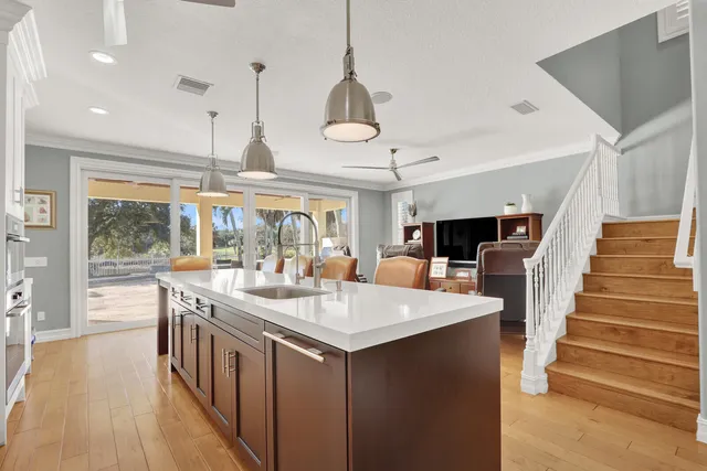 a kitchen with stainless steel appliances a stove microwave and cabinets