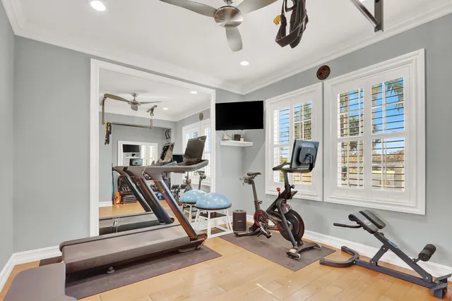 a view of a livingroom with workspace and a window