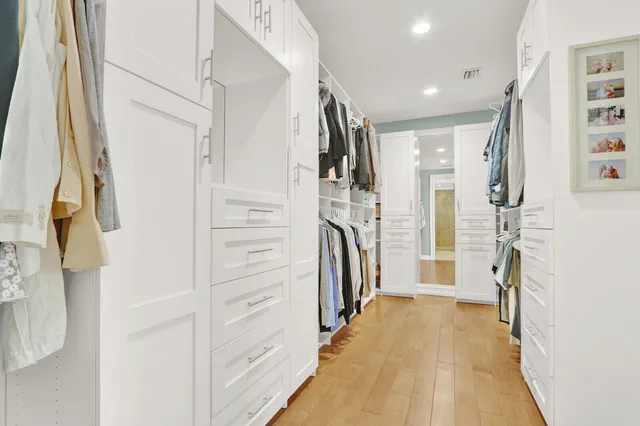 a bathroom with a double vanity sink mirror and shower