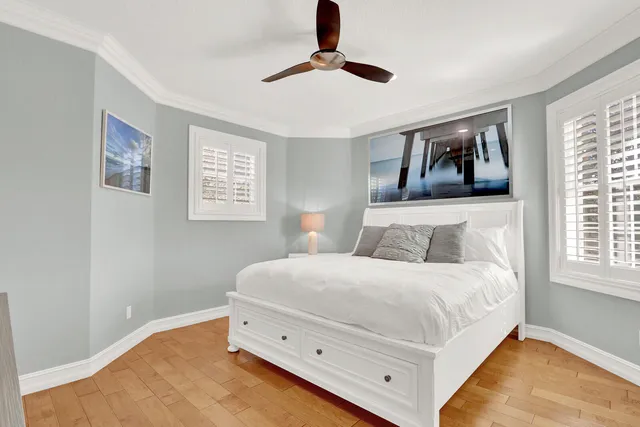 a bedroom with a bed and a table