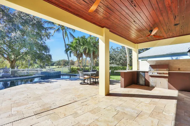 a view of a backyard with sitting area
