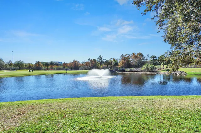 a view of a house with swimming pool and sitting area
