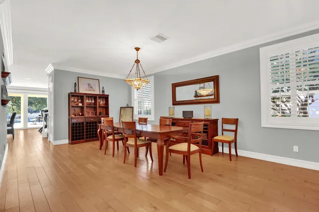 a view of a livingroom with furniture window and wooden floor