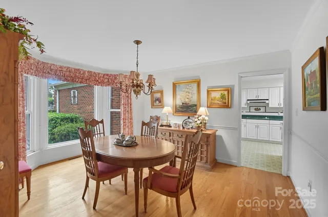 a view of a dining room with furniture and window