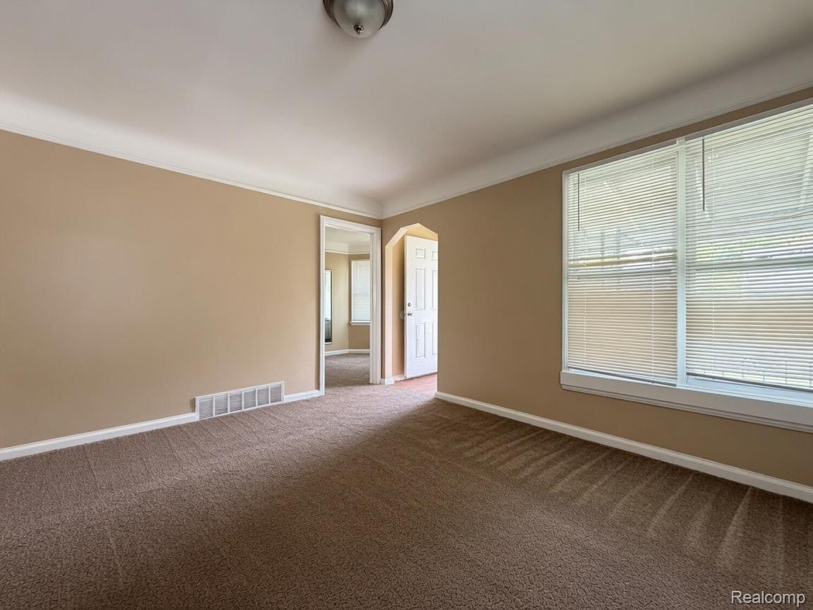 7286 Faust Avenue Detroit, MI 48228 - Photo 17 of 19 Carpeted room with neutral wall paint and white trim