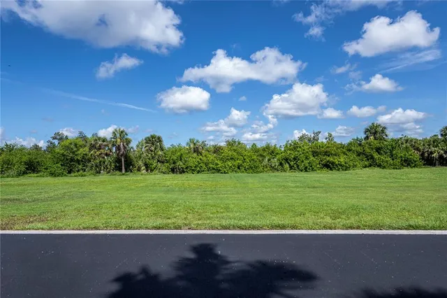 a view of a golf course with street