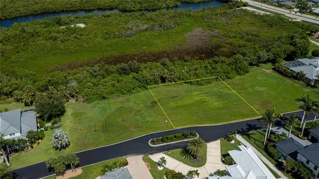 a view of a golf course with a lake