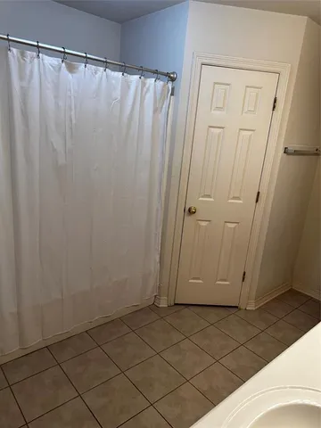a view of a closet area with wooden fence