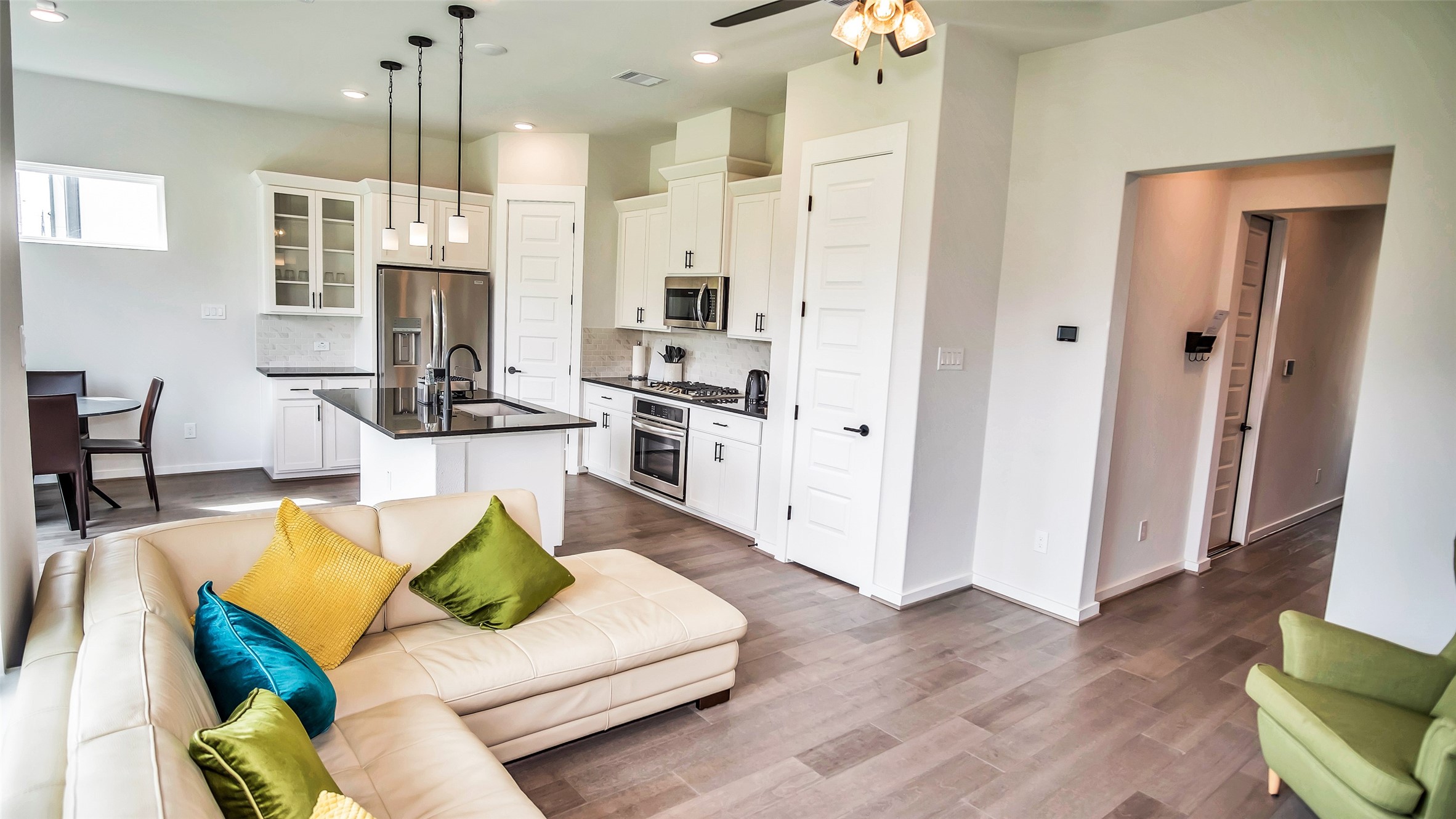 1919 Pueblo Nuevo Path Houston, TX 77077 - Photo 41 of 50 a living room with furniture and a wooden floor