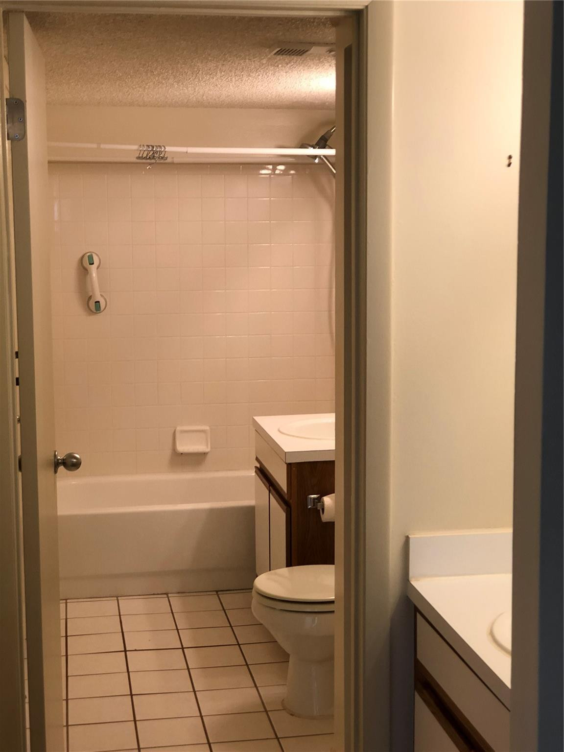 6331 La Costa Drive, Unit G Boca Raton, FL 33433 - Photo 7 of 12 a bathroom with a toilet and a shower