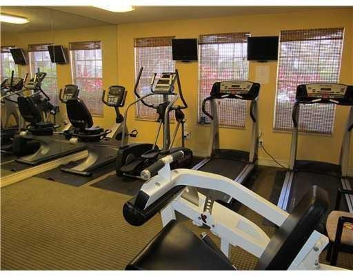 6331 La Costa Drive, Unit G Boca Raton, FL 33433 - Photo 8 of 12 a room with gym equipment and windows